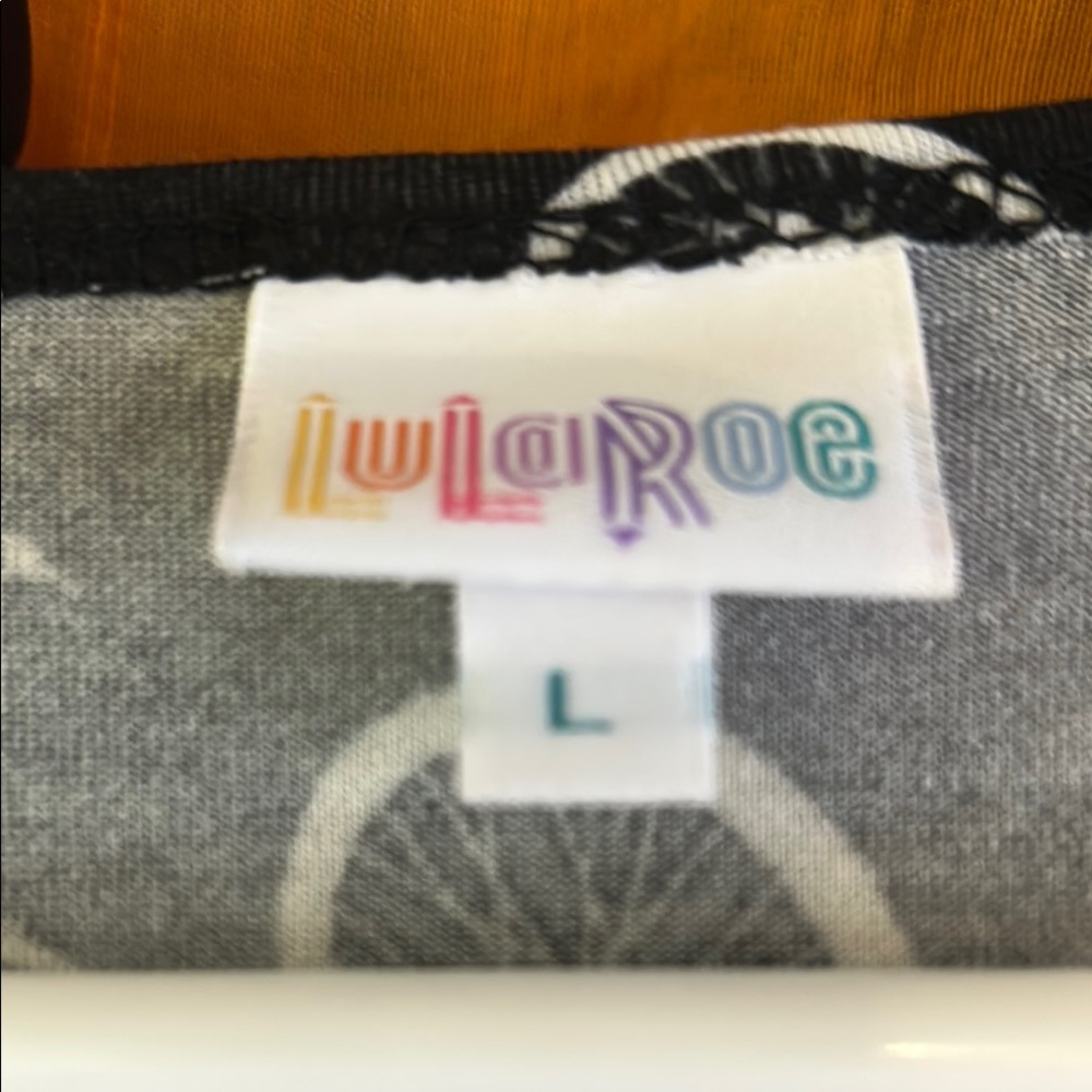 LuLaRoe black Patterned Tee retro bicycle high low hem never worn